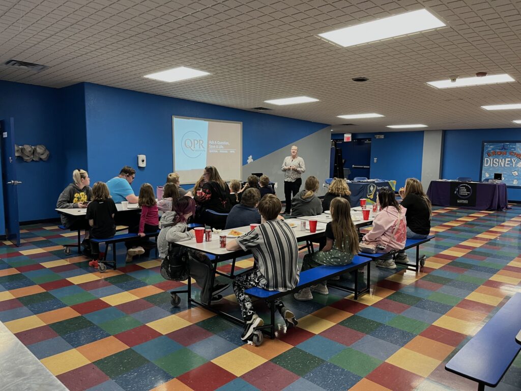 Classroom presentation in a large room with students and a TCHD staff person teaching.