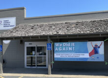 Front of Forsyth office with banner reading "We did it again!"
