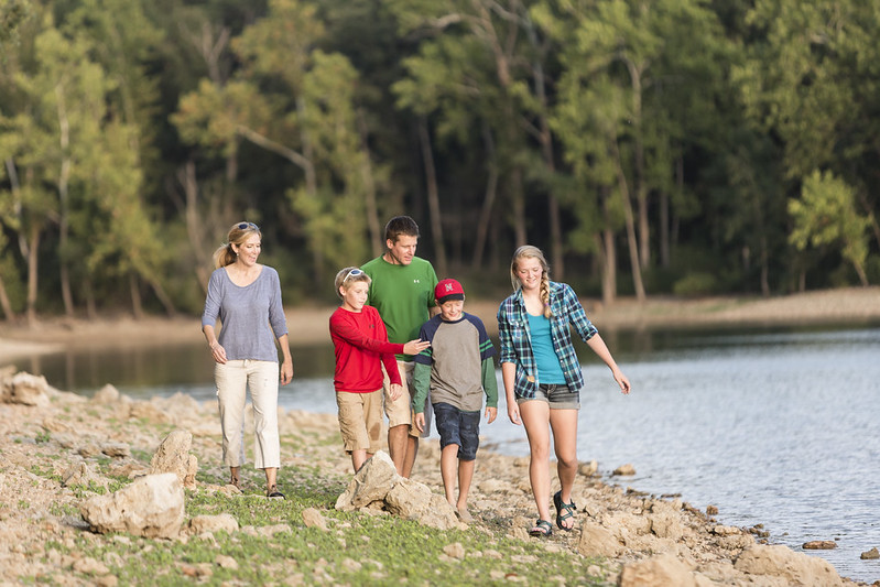family on beach at lake