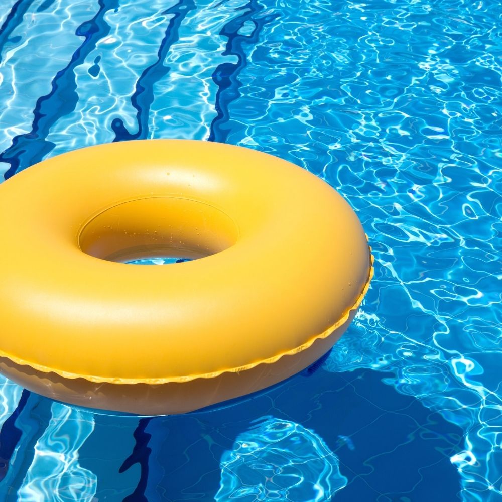pool with yellow tube floating