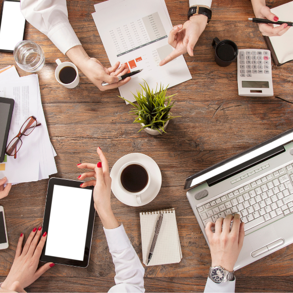 table with people sitting around having a meeting