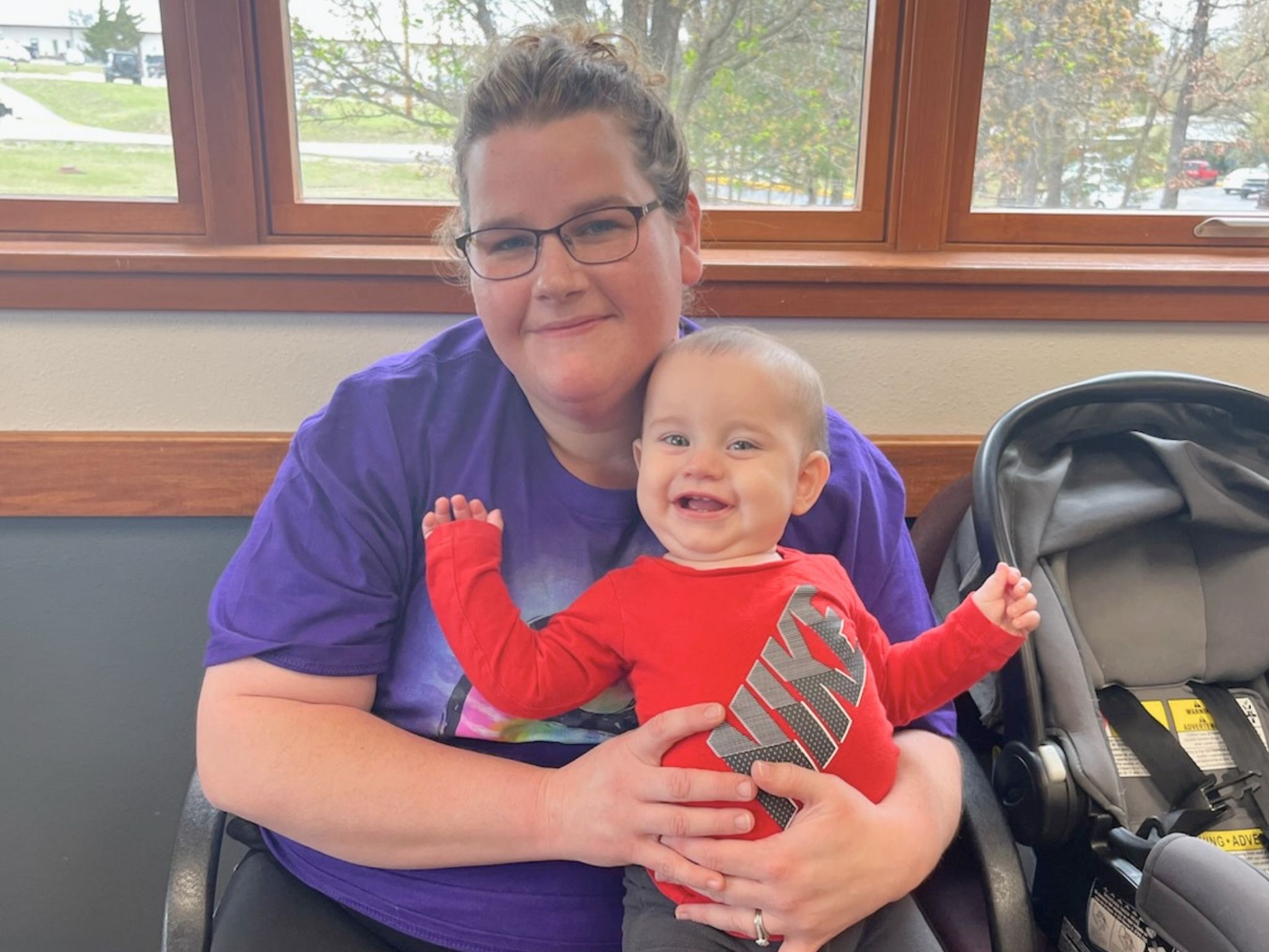 Mother and toddler sitting in the Taney County Health Department waiting room.